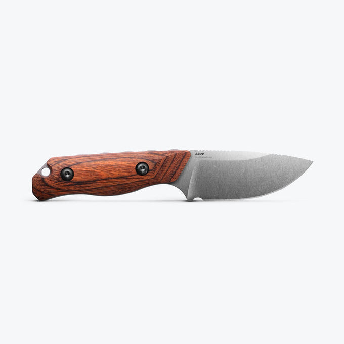 Folding knife with wooden handle on a white background